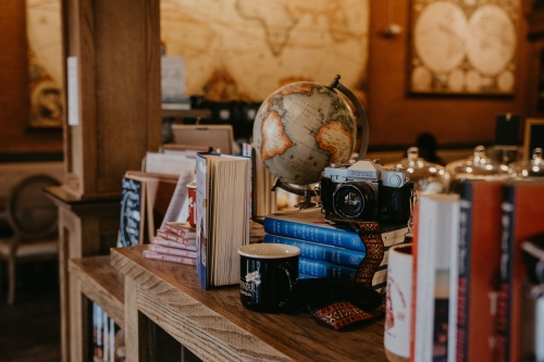 vintage camera, globe, and other vintage decor items