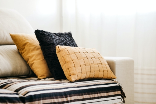 brown and black throw pillows for sofa in the living room