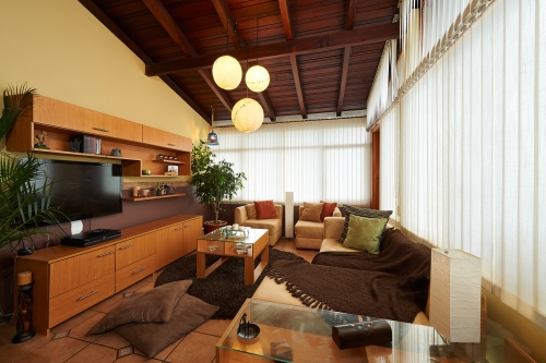 rustic living room with yellow walls and wooden furniture