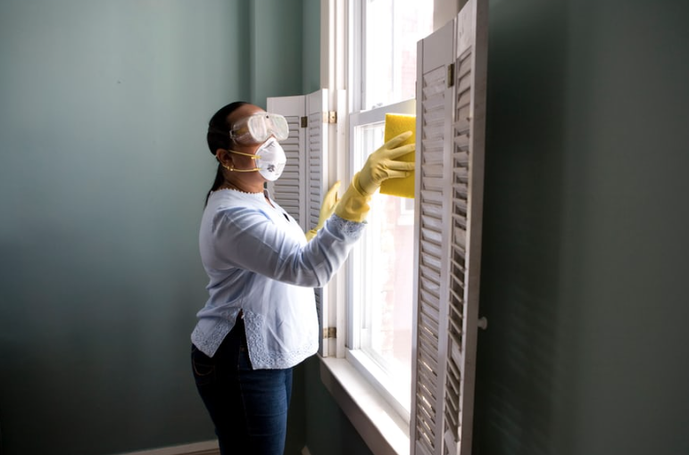 A woman cleaning glass