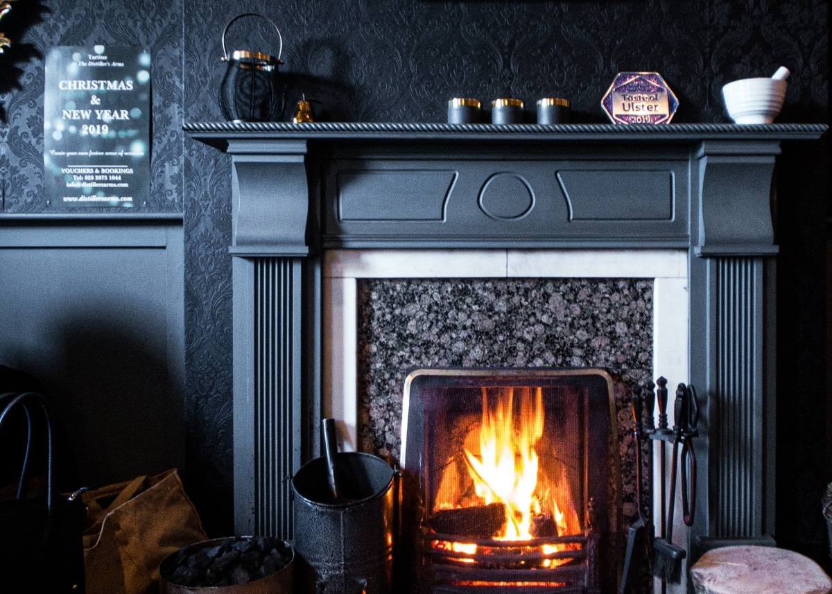 moody fireplace in dark interiors