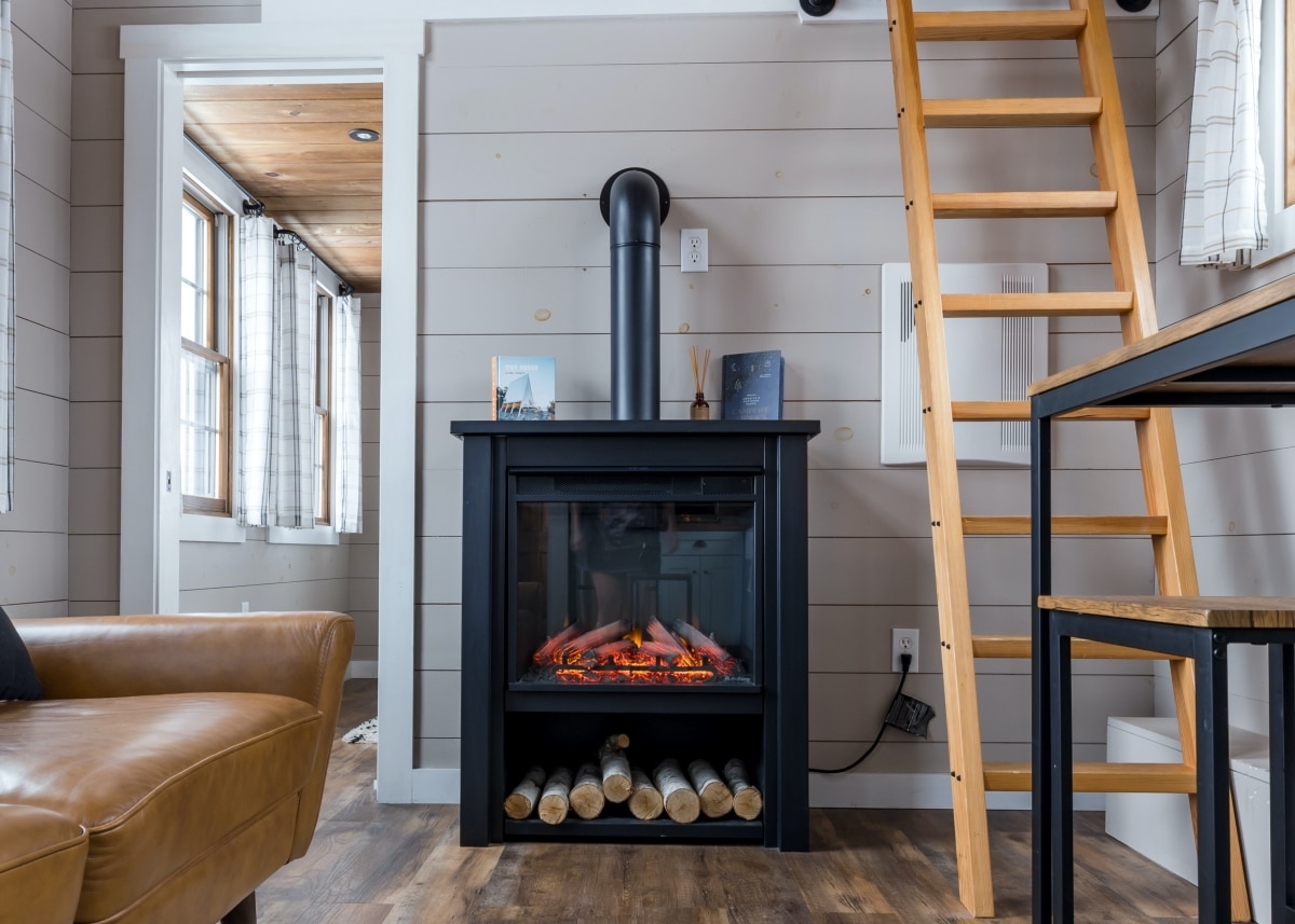 standalone fireplace beside ladder