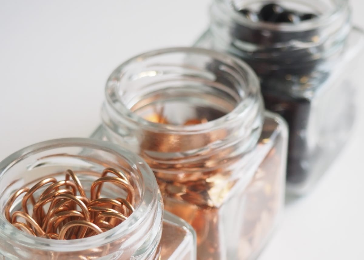 office supplies organised in jars