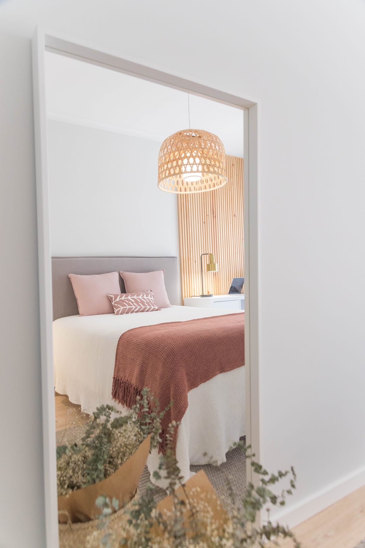 white bed with red, pink, and white bed linen