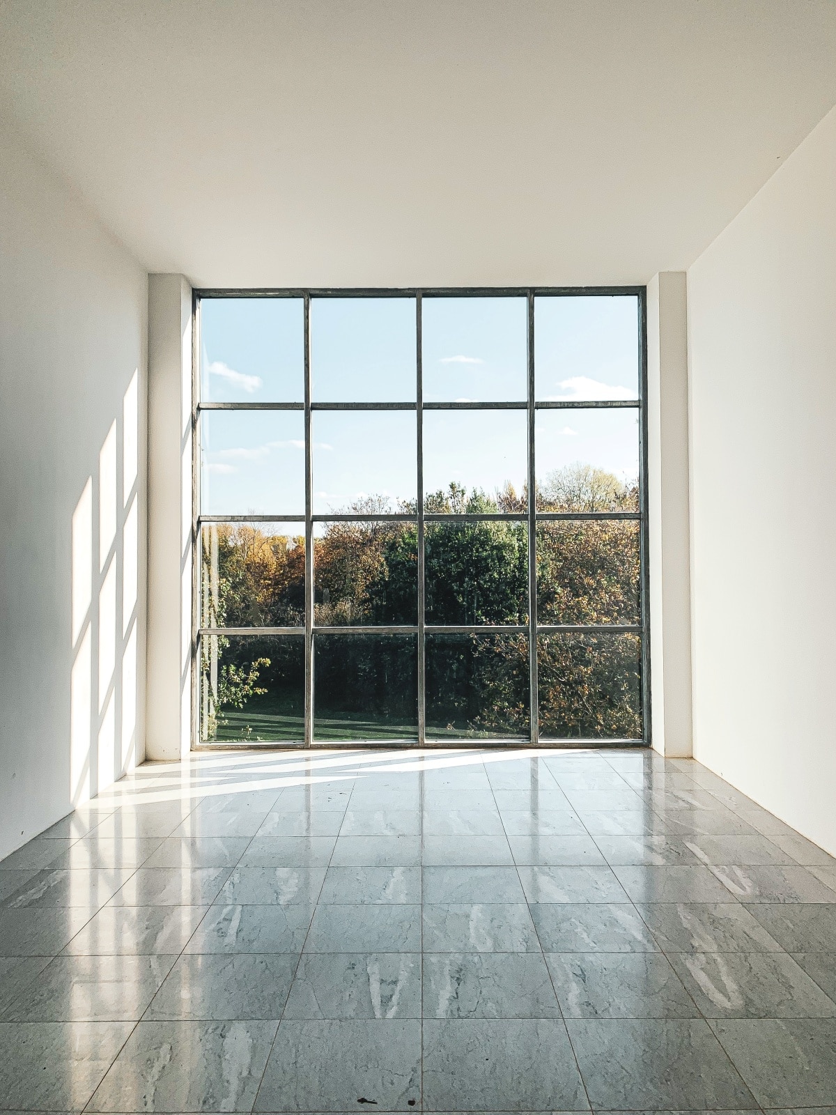 White room with black steel windows