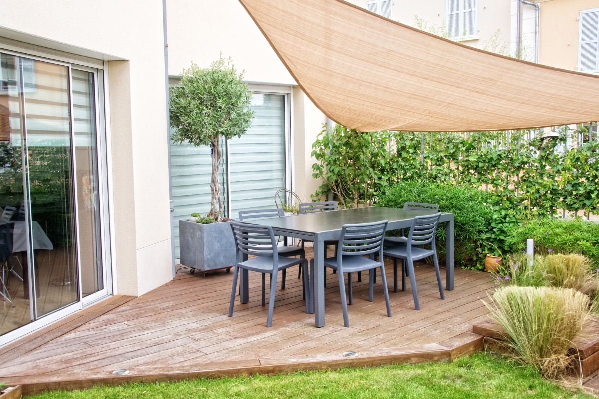 Modern terrace with dining table and chairs