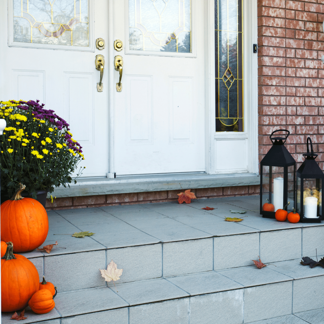 a porch with freshly painted double doors