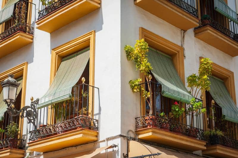 balcony with outdoor wooden window blinds