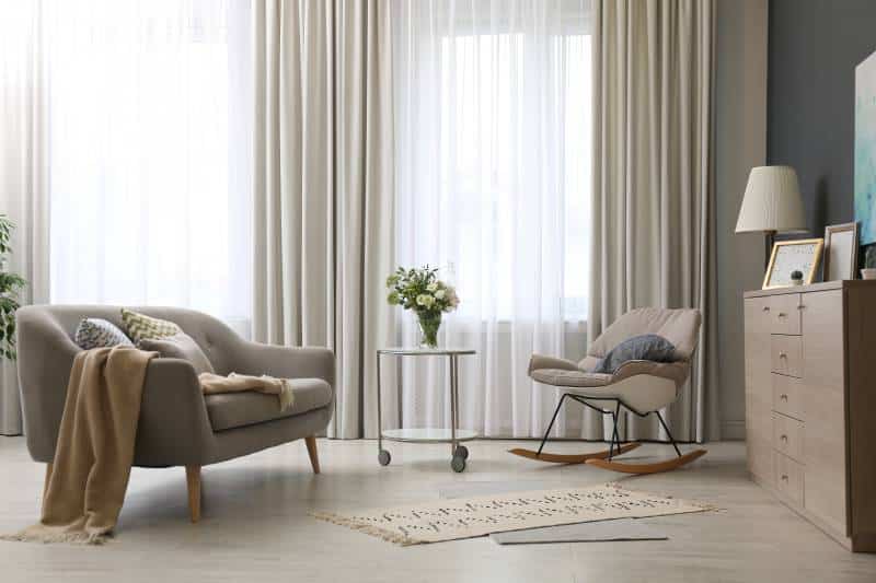 modern living room interior with beautiful blackout and sheer curtains on window