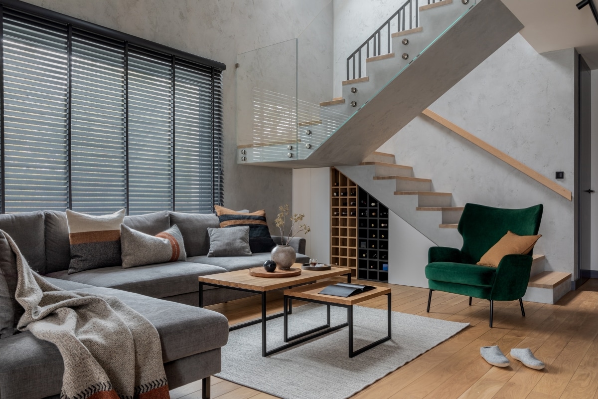 Modern living room with a wine storage underneath the stairs