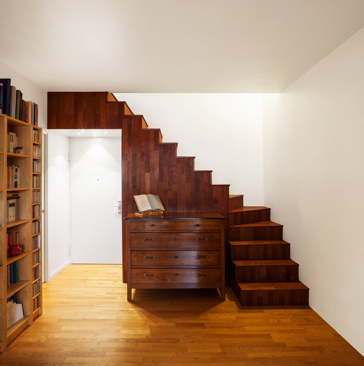 Modern loft with door under stairs