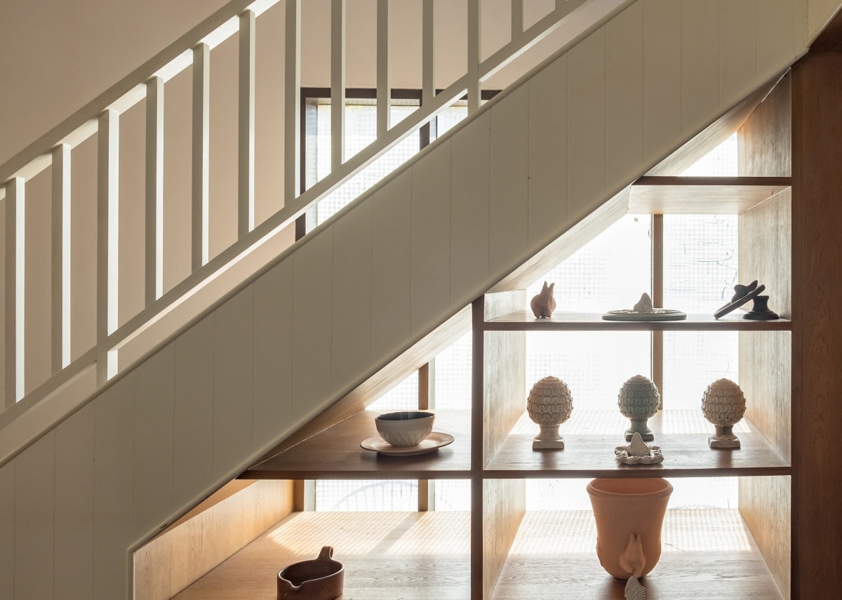 Wooden staircase with decorative shelf