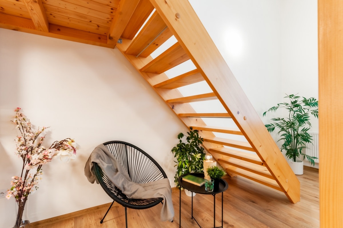 A cozy reading corner at home with a small armchair in modern design, accompanied by a similar size coffee table