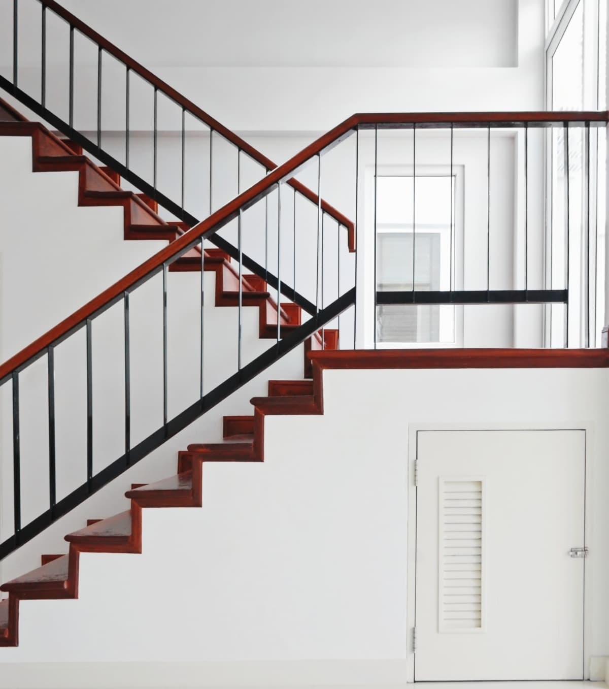 Storage room under wooden staircase