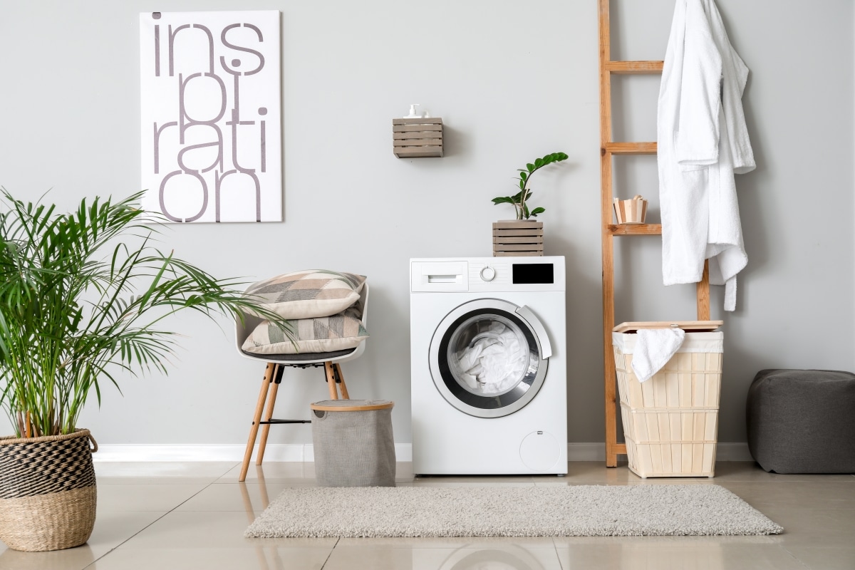 Interior of home laundry room with modern washing machine