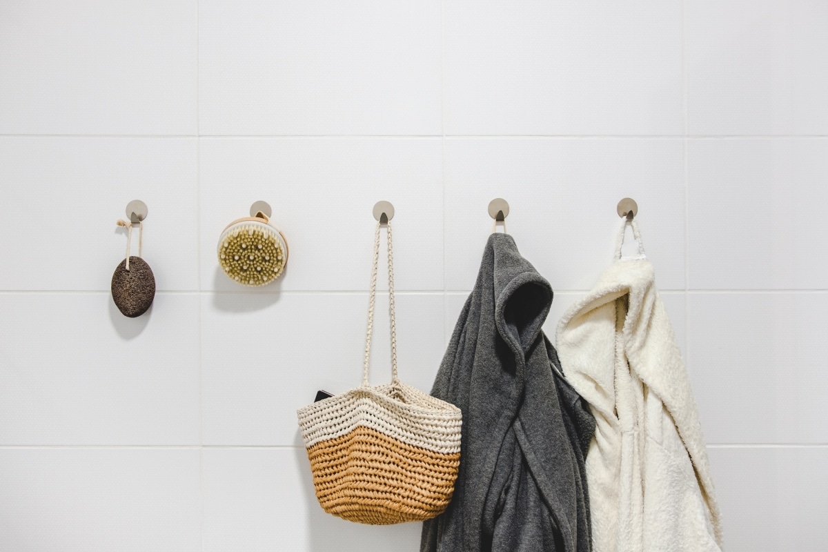 basket and bathrobes on hooks