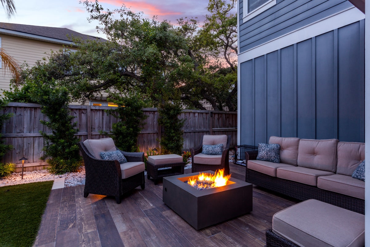 Beautiful backyard firepit at dusk with comfortable chairs