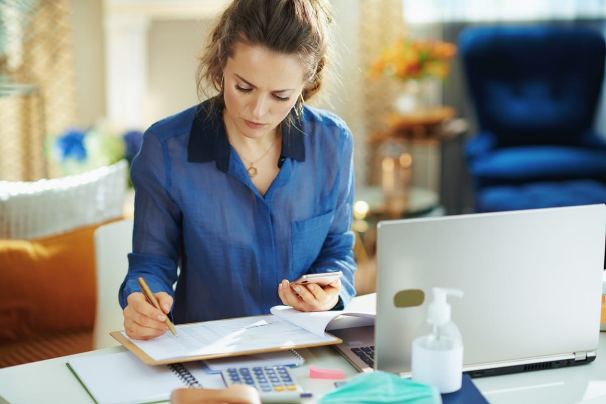 Woman calculating expenses