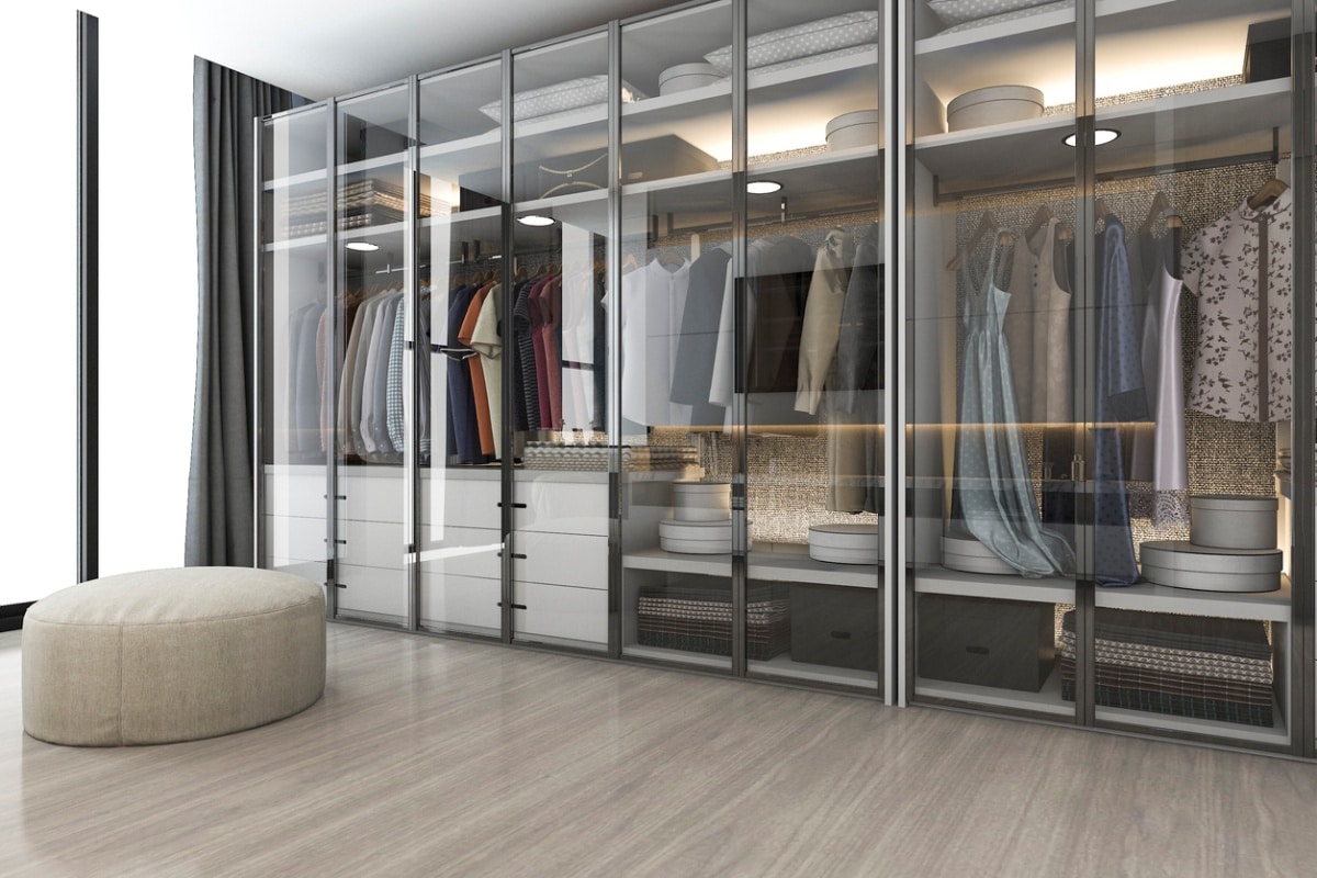 modern scandinavian white wood walk in closet with wardrobe near window