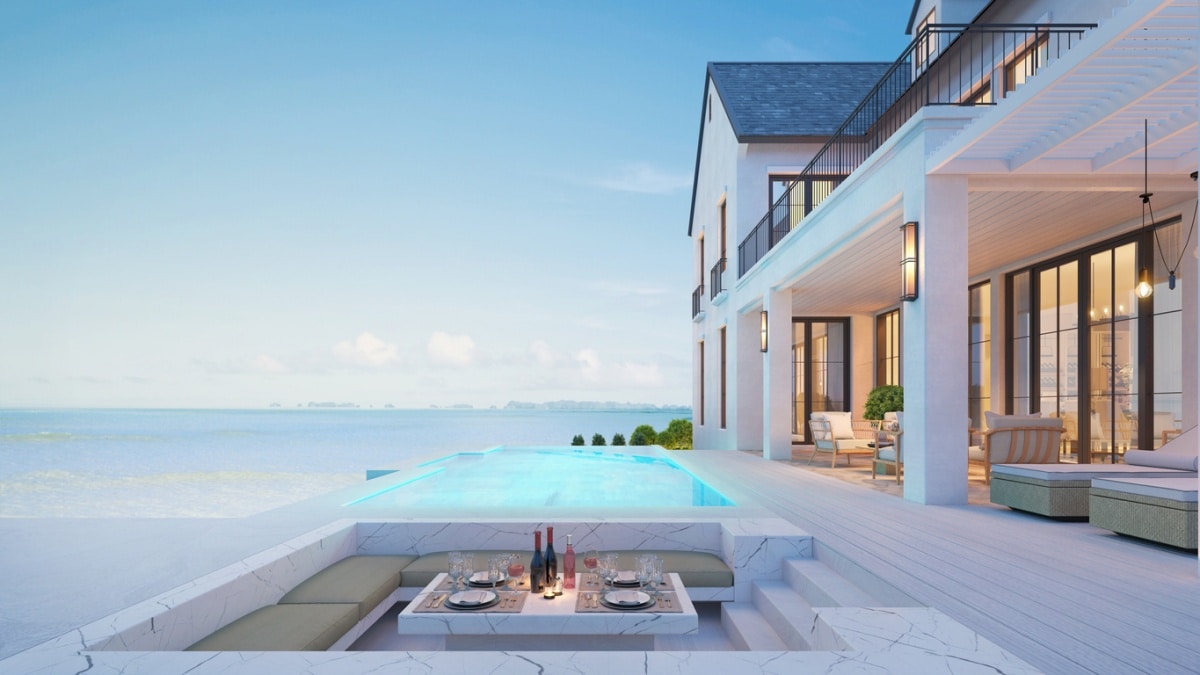 luxury beach house with a sunken seating area and pool