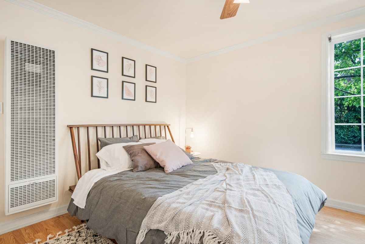 Bed with a slanted bamboo headboard