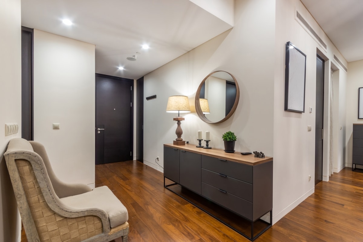 hallway dresser and round mirror
