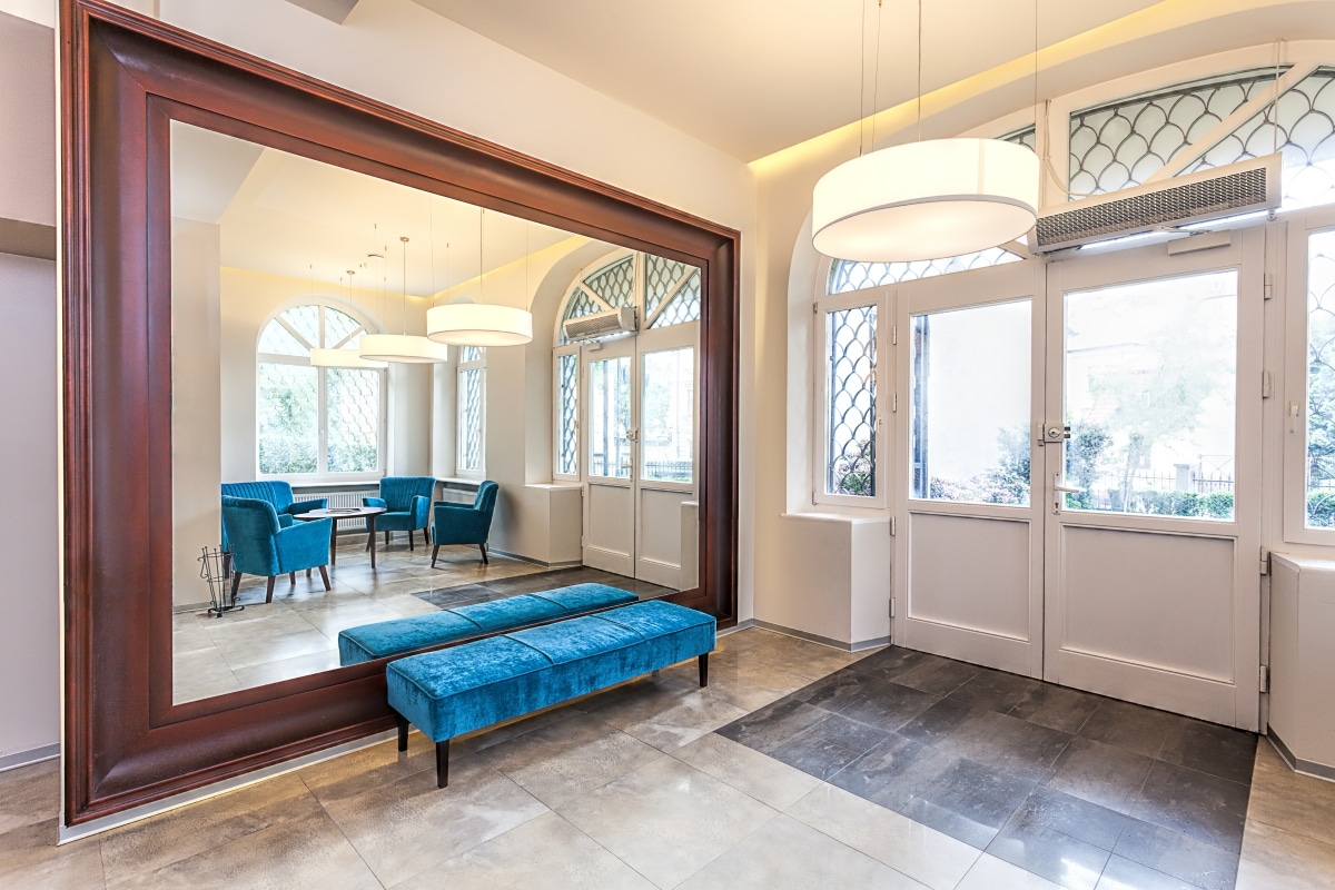 hallway with floor to ceiling mirror