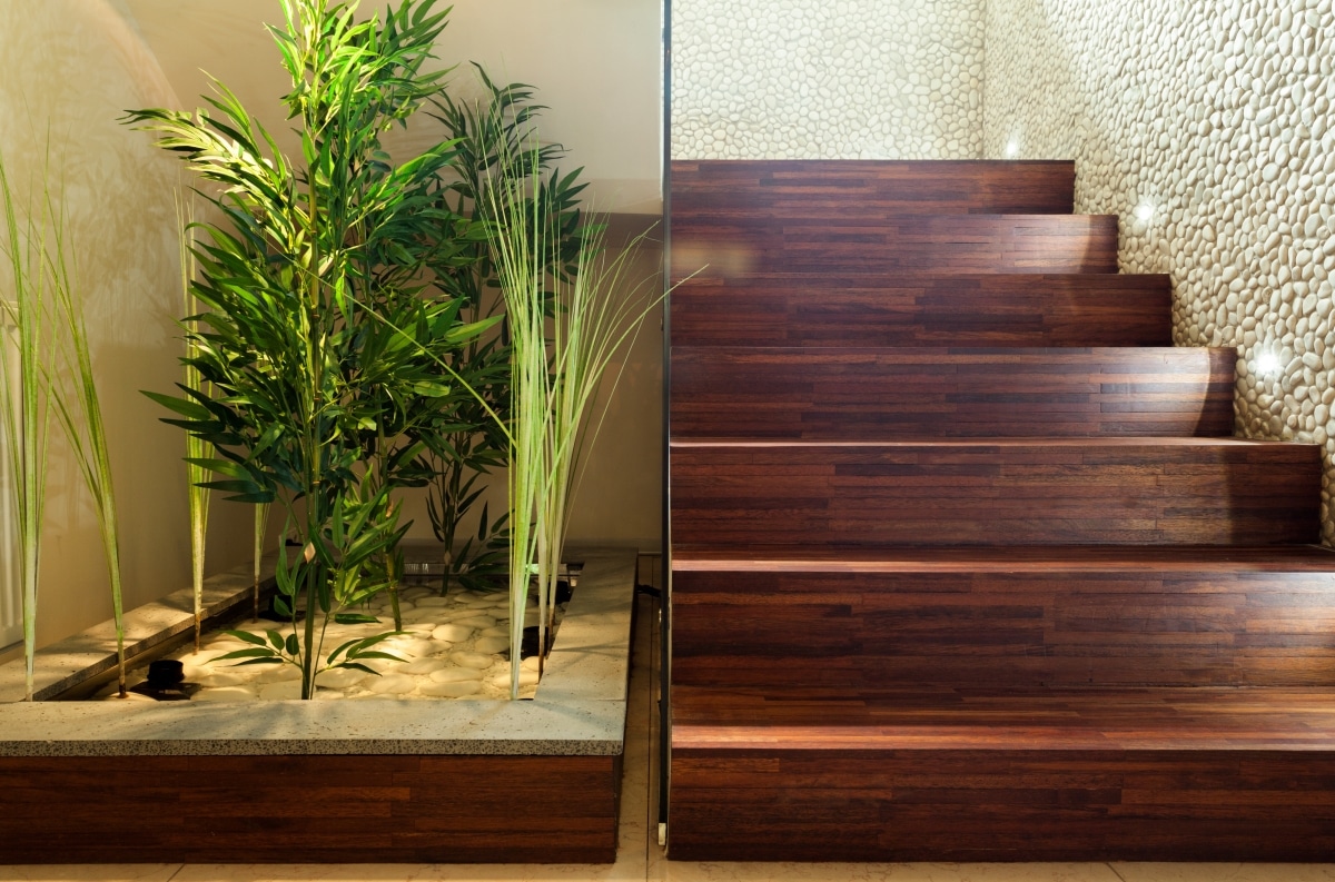 hallway garden tucked by wooden stairs