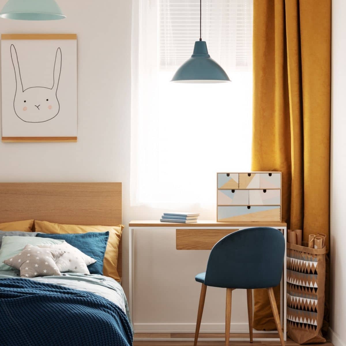 a teal and orange bedroom with a desk and hanging lights