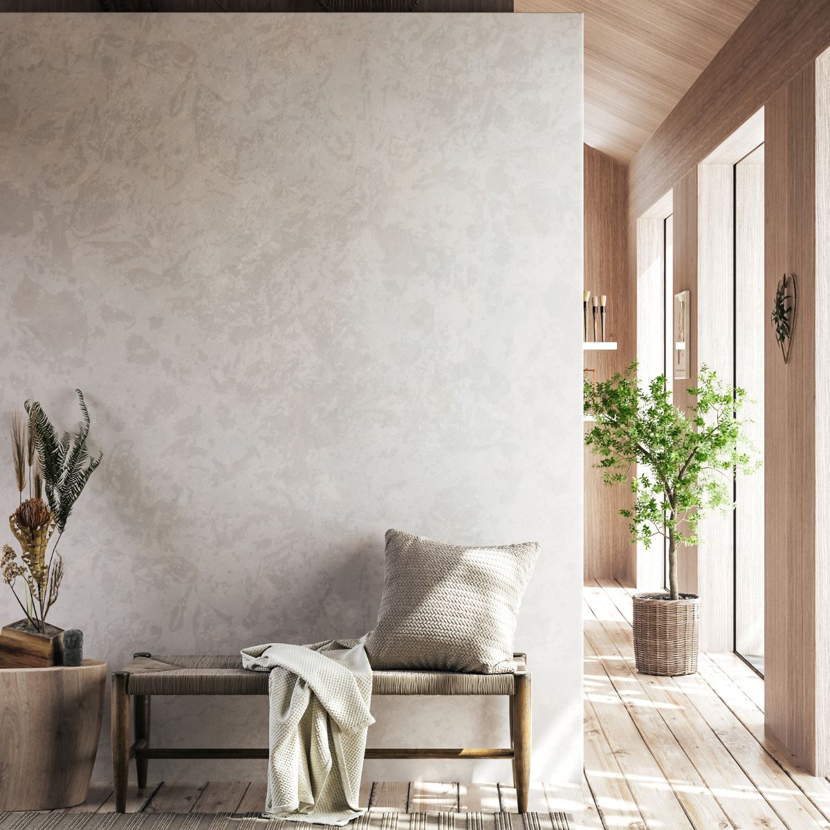 a hallway with a stylish bench, plants, a pillow, and a blanket