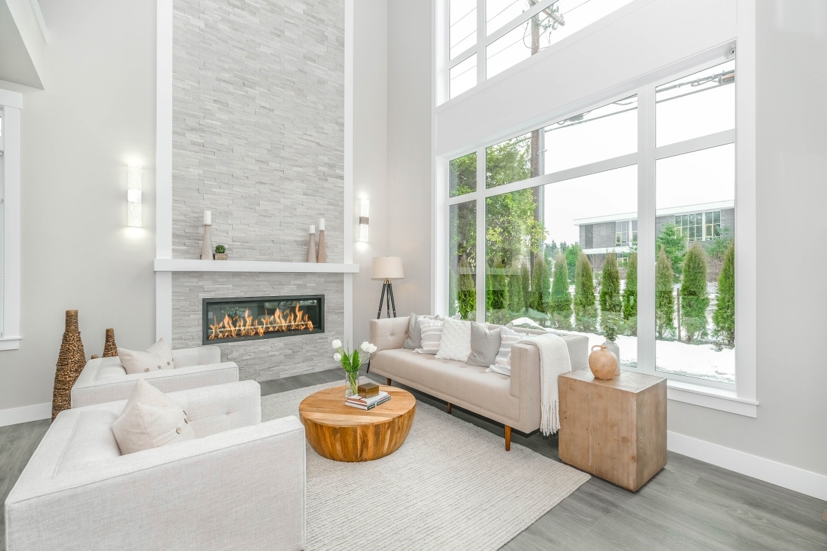 white couch near large glass window