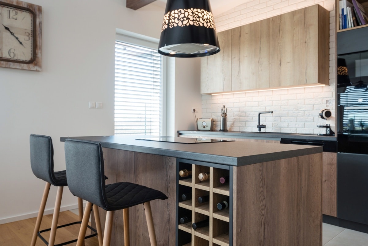 Contemporary kitchen interior with wine rack in island