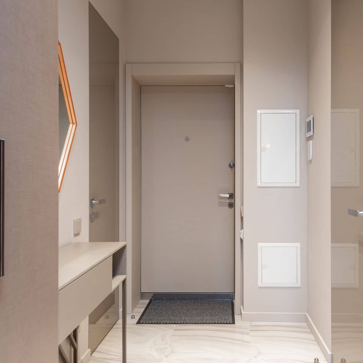 a beige hallway with white details
