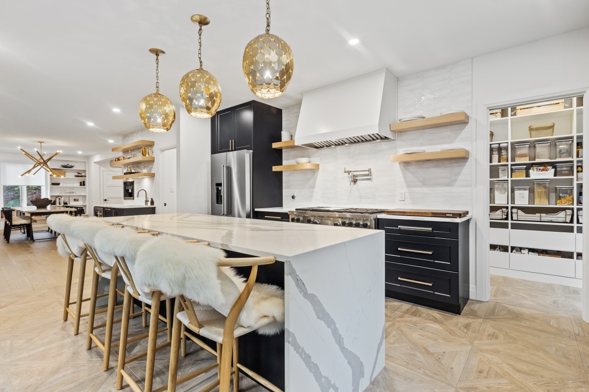 kitchen with marble island and comfy bar stools
