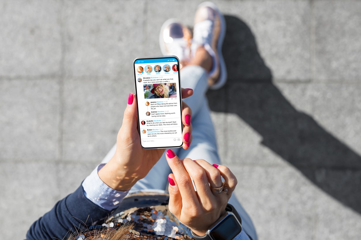 Woman using social media app on her phone