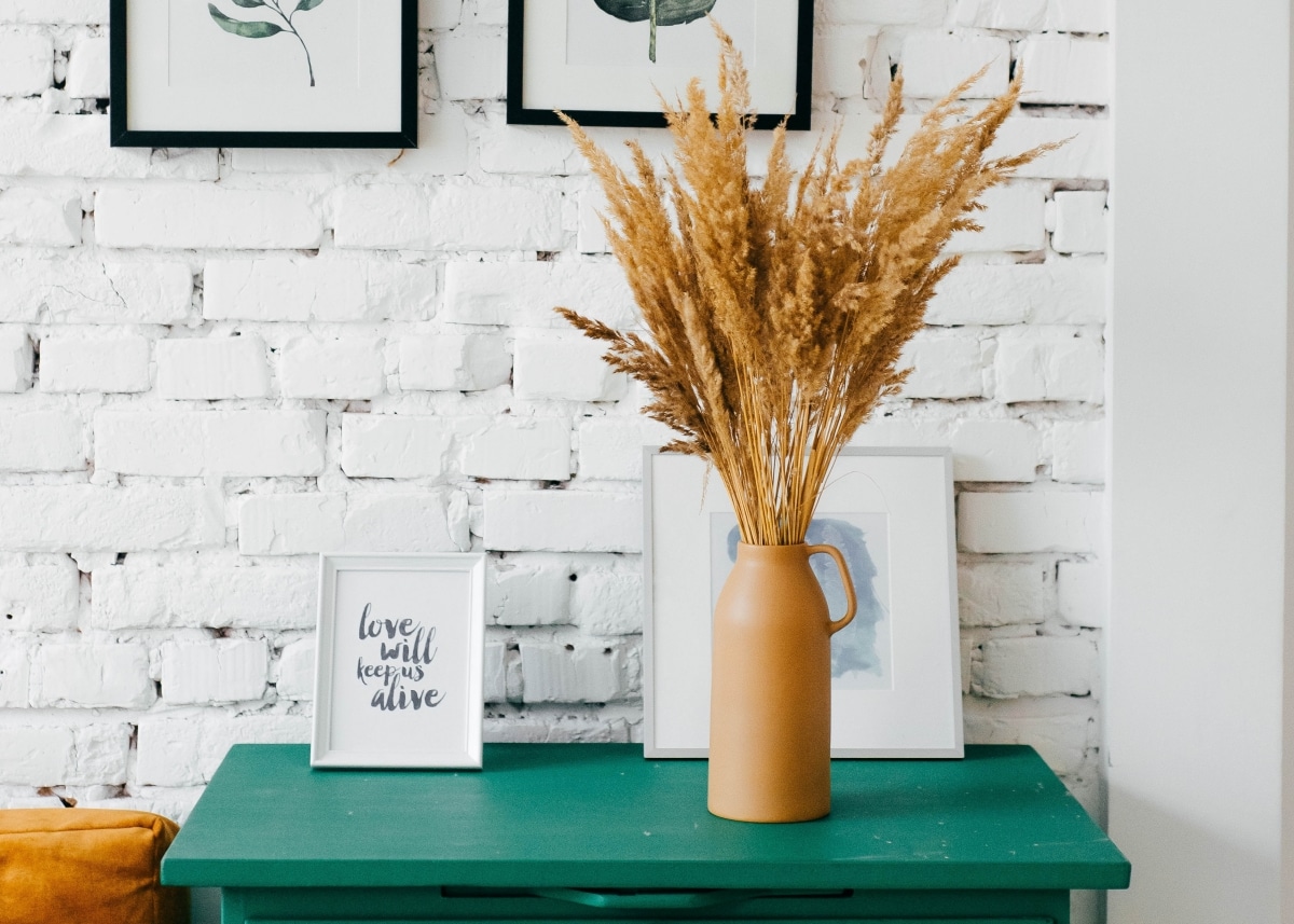 green table with mustard vase