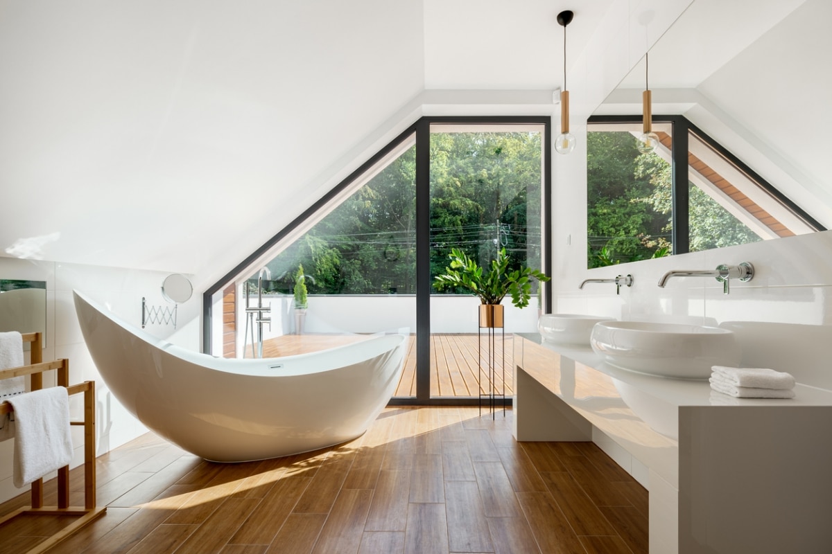 attic bathroom with floor-to-ceiling window