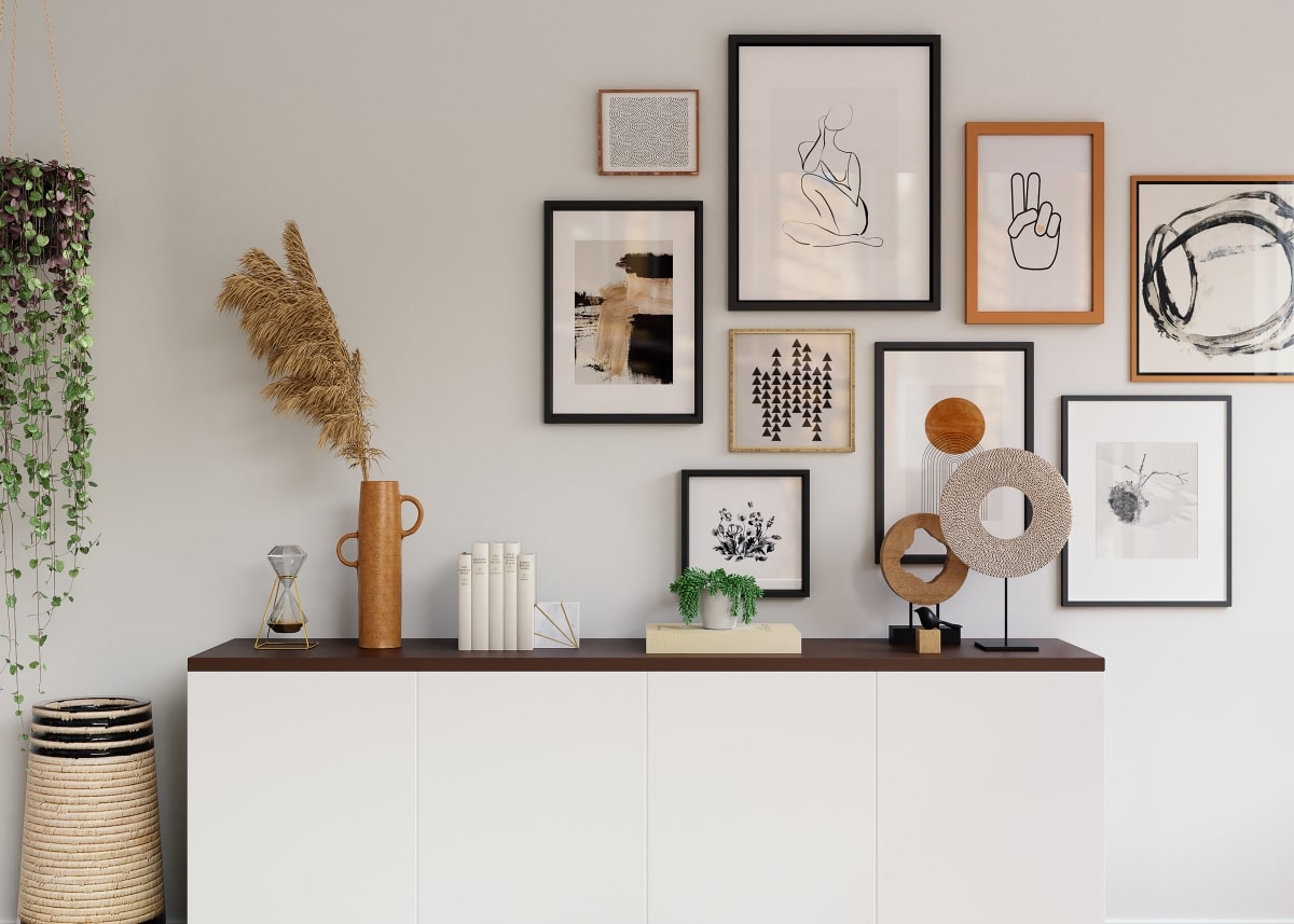 fully decorated hallway cabinet with framed art