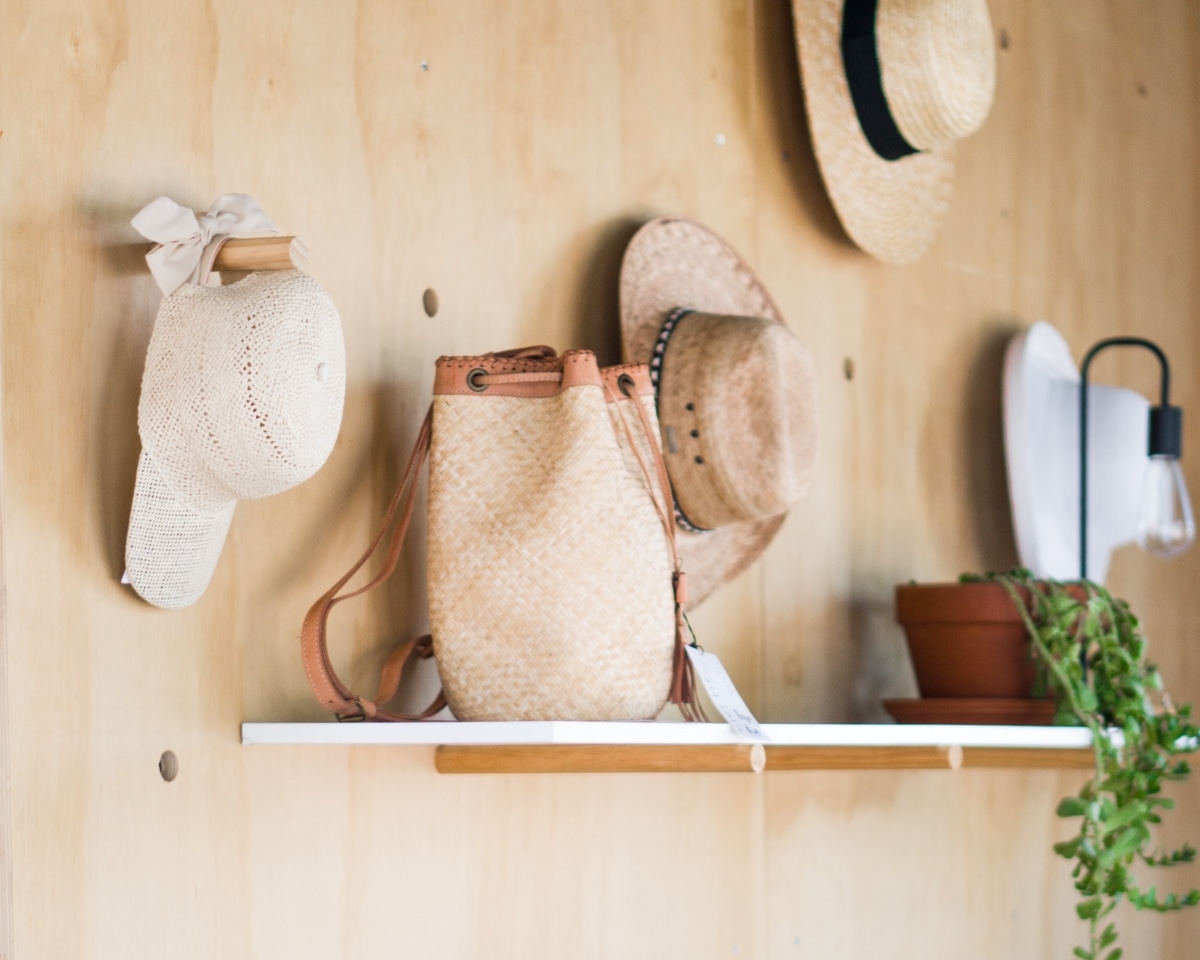 wall with hat hooks and shelf
